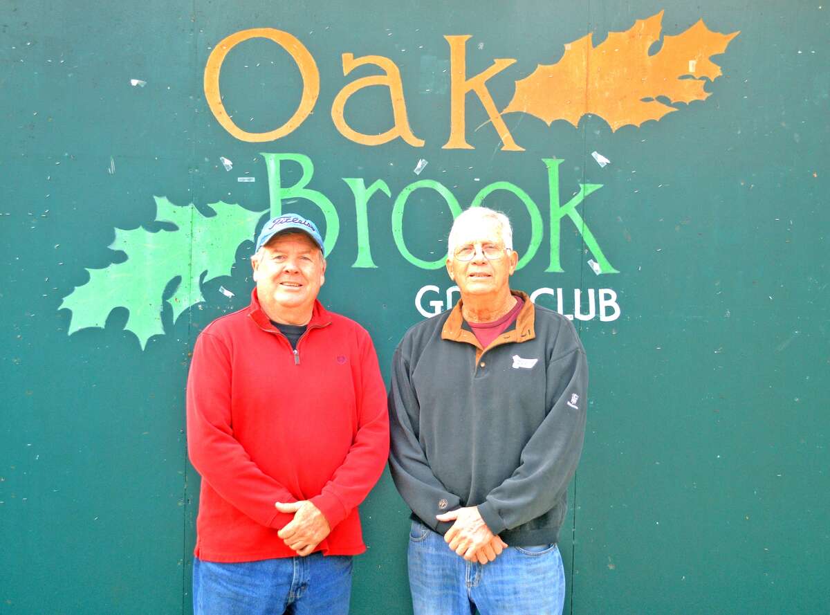 Oak Brook Golf Club superintendent Fred Ehlke, left, poses with owner Larry Suhre. Ehlke retired on Wednesday after 40 years on the job.