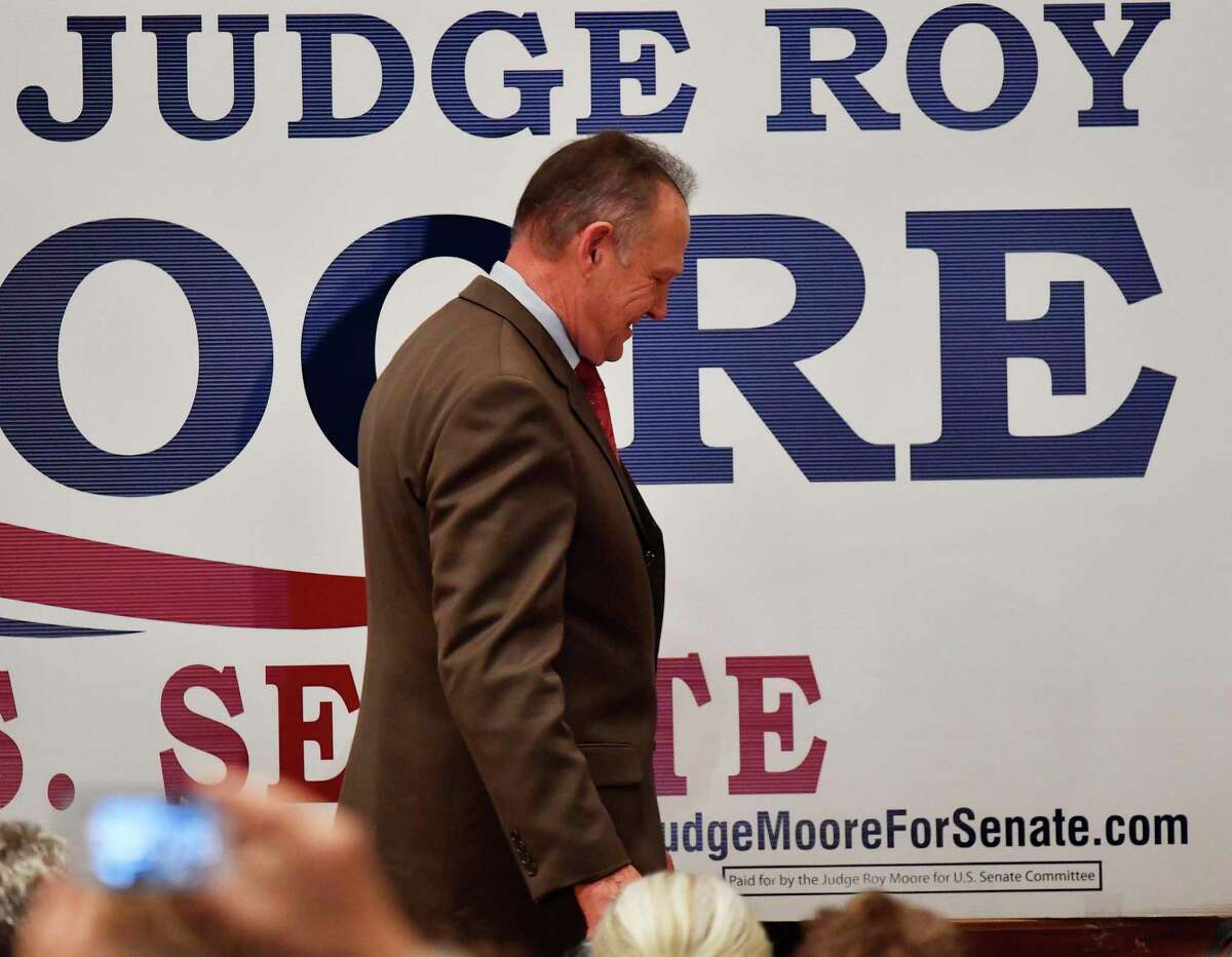 U.S. Senate candidate Roy Moore leaves the stage after giving a speech at the end of an election-night watch party at the RSA activity center, Tuesday, Dec. 12, 2017, in Montgomery, Ala. (AP Photo/Mike Stewart)
