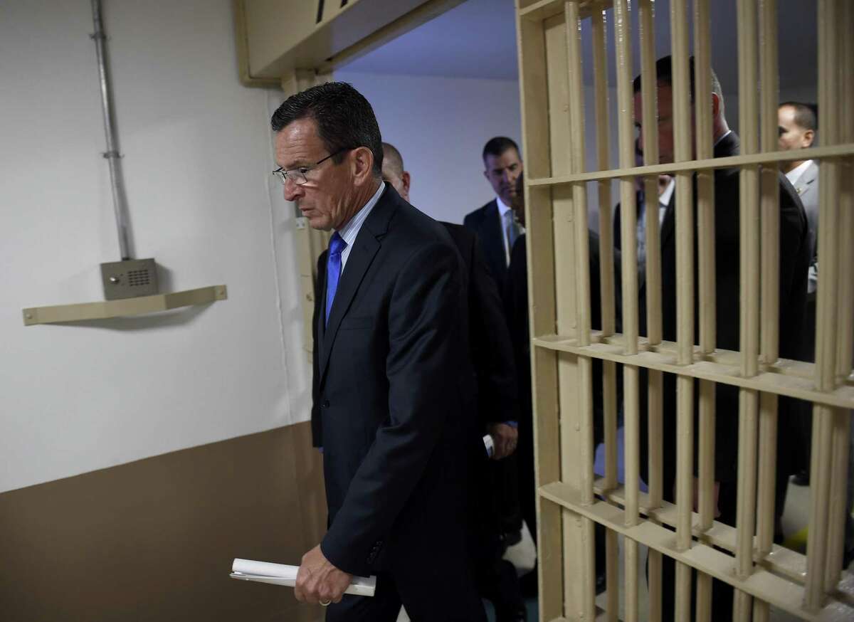 Gov. Dannel P. Malloy, shown here in a 2015 visit to the Hartford Correctional Center, has led efforts to divert non-violent offenders from prison. The inmate population reached a 23-year low on Thursday.