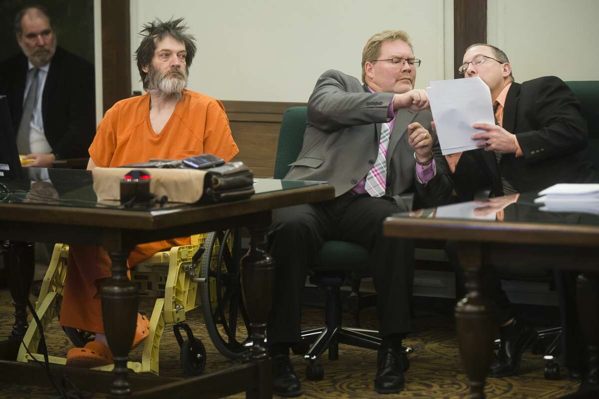 Michael Todd McIntyre listens on Thursday during his sentencing at the Midland County Courthouse for the 1991 murder of Diane Ross. McIntyre was sentenced to life in prison without the possibility of parole. (Katy Kildee/kkildee@mdn.net)