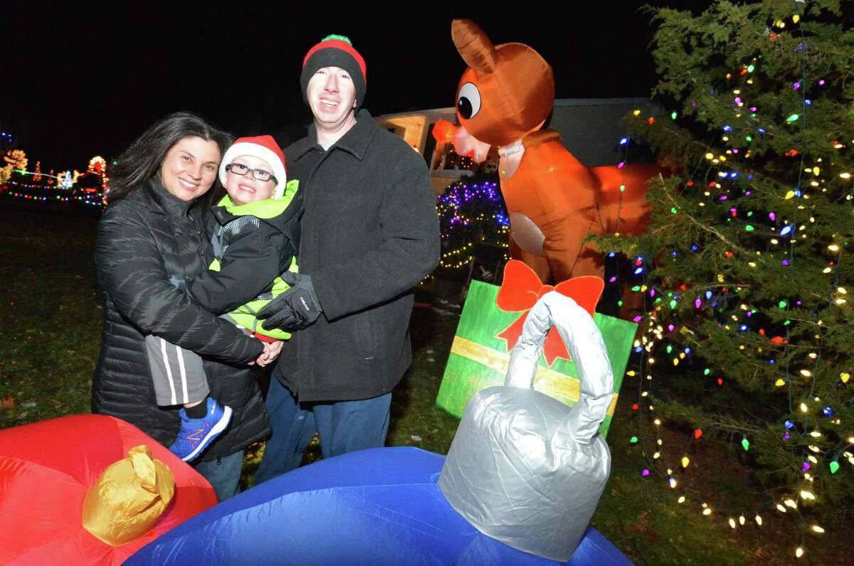 The Kovatch family, Richard, Tina and 5-year-old Matthew, in the front yard they have decorated for the holidays with giant inflatable figures, handmade signs, thousands of lights and Christmas decorations all over their Norwalk home.
