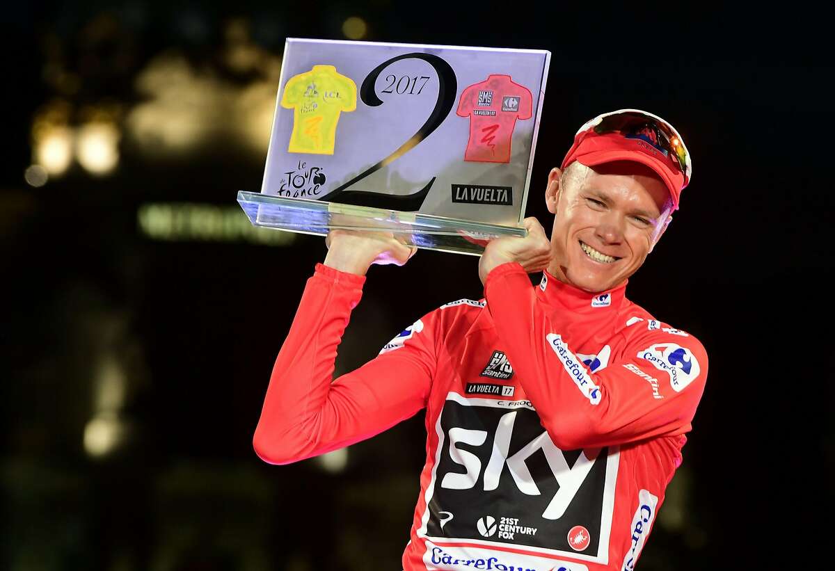 (FILES) This file photo taken on September 10, 2017 shows Team Sky's British cyclist Chris Froome celebrating on the podium winning the 72nd edition of "La Vuelta" Tour of Spain cycling race, in Madrid. Froome, four-time winner of the Tour de France, has been tested positive for the bronchodilator 'Salbutamol' during the 2017 Tour of Spain that he won, the International Cycling Union (UCI) said in a statement on December 13, 2017. / AFP PHOTO / JOSE JORDANJOSE JORDAN/AFP/Getty Images