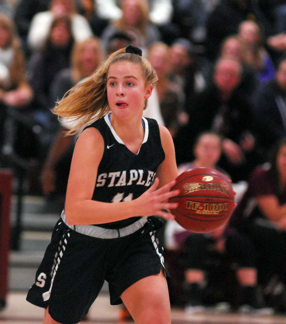 Staples’ Elle Fair moves with the ball during a game at Bethel on Thursday.