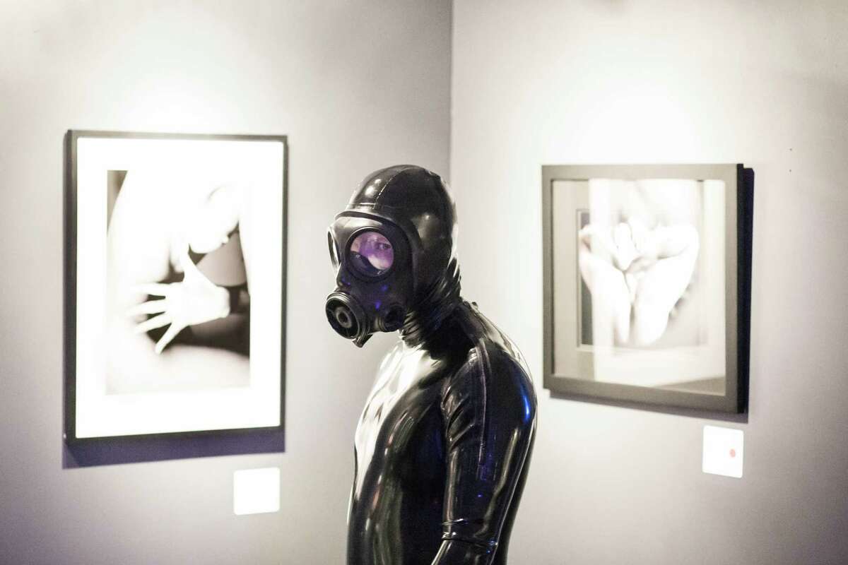 "Spoon" checks out the artwork at the Seattle Erotic Art Festival at the Seattle Center Exhibition Hall on Friday, April 28, 2017.