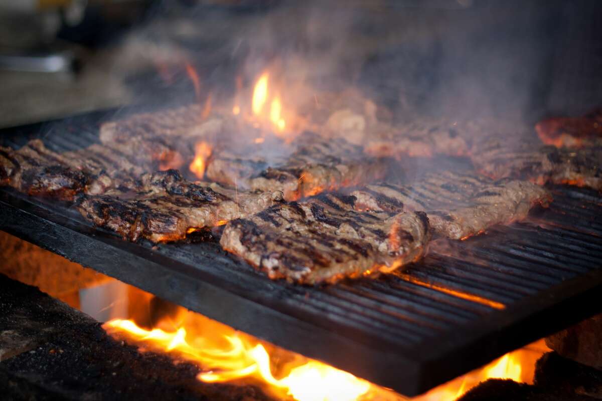 Steaks cooking on a wood grill. David Burke Prime, Foxwoods Resort Casino, Mashantucket New London County Chuck’s Steak House and Margarita Grill, Storrs Tolland County Grill 445, Brooklyn Windham County