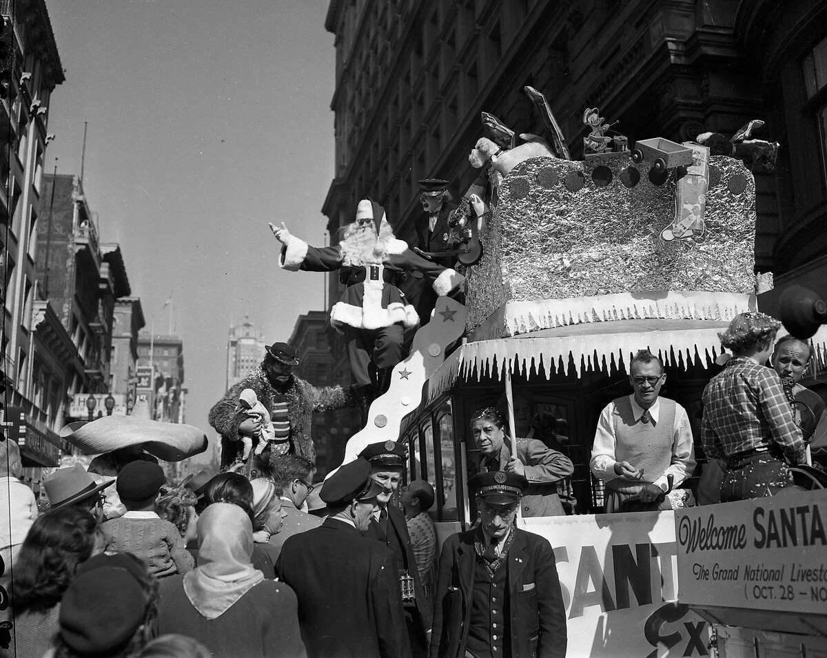 Santa arrives by cable car at the Emporium on Oct. 29, 1949. 