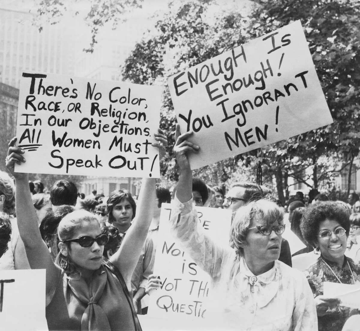 Women hold up signs demanding equal rights during a demonstration for women's liberation, New York City.