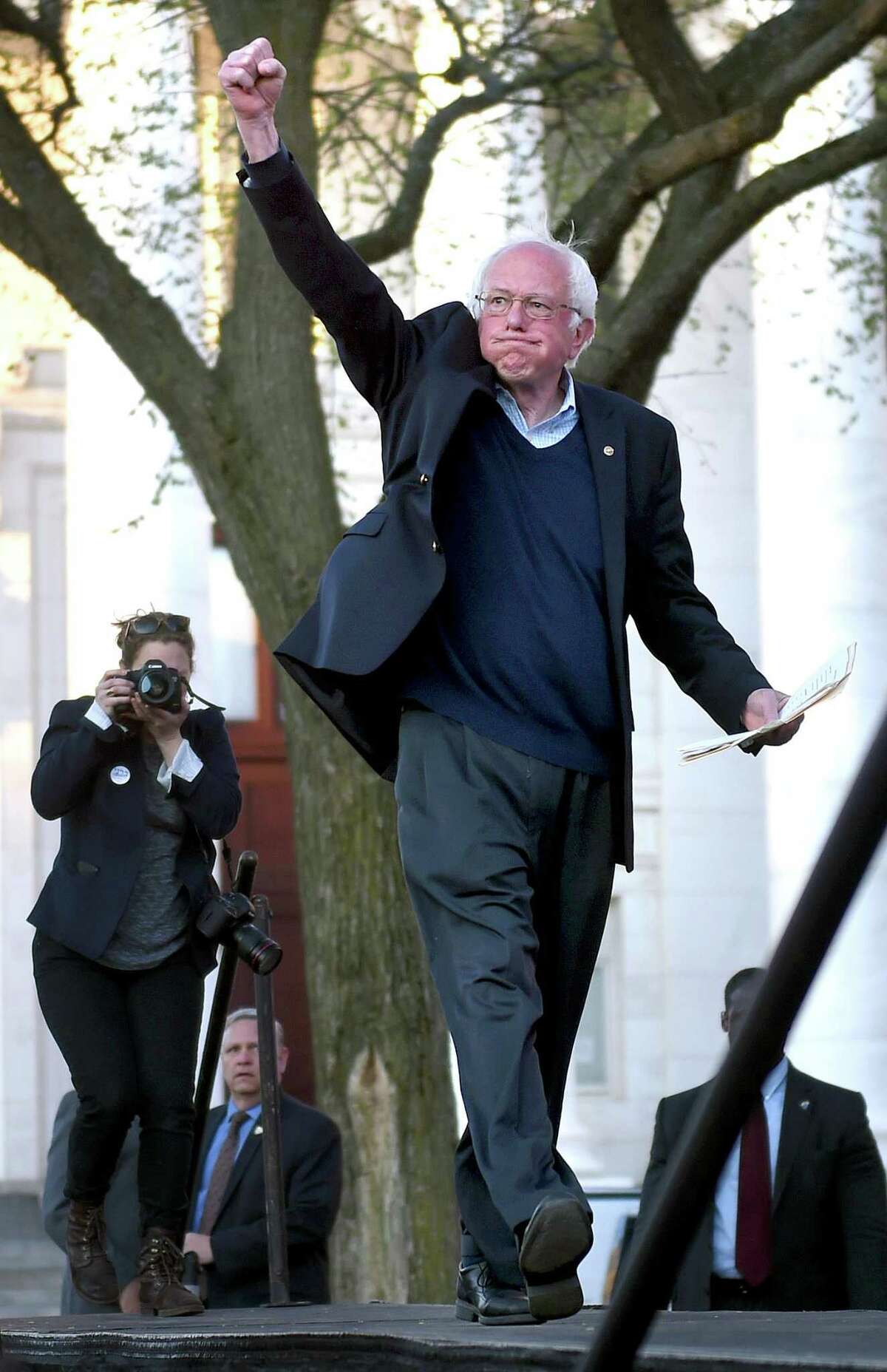 (Arnold Gold-New Haven Register) Democratic presidential candidate Bernie Sanders walks on stage for a rally on the New Haven Green on 4/24/2016.