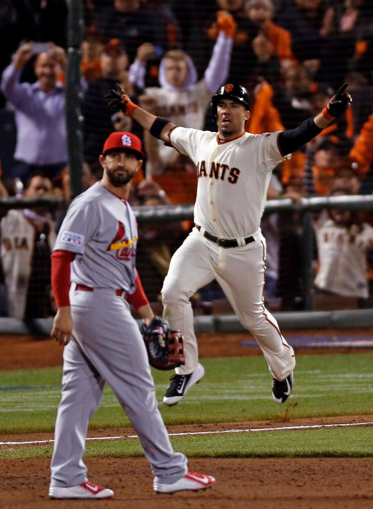 San Francisco Giants' Travis Ishikawa hits a game-winning 3-run home run in 9th inning of 6-3 win over St. Louis Cardinals in Game 5 of the NLCS at AT&T Park in San Francisco, Calif. on Thursday, October 16, 2014.