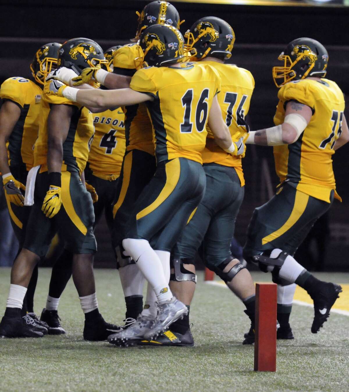 North Dakota State players celebrate after running back Bruce Anderson scored a touchdown during an NCAA college football game against Sam Houston State, Friday, Dec. 15, 2017 in Fargo, N.D. North Dakota State took back the Football Championship Subdivision title, beating James Madison 17-13 on Saturday. (Gene Schallenberg/The Huntsville Item via AP)