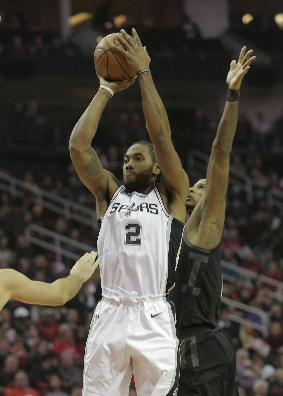 San Antonio Spurs forward Kawhi Leonard (2) puts up a shot against the Houston Rockets ain the first quarter at the Toyota Center on Friday, Dec. 15, 2017, in Houston. ( Elizabeth Conley / Houston Chronicle )