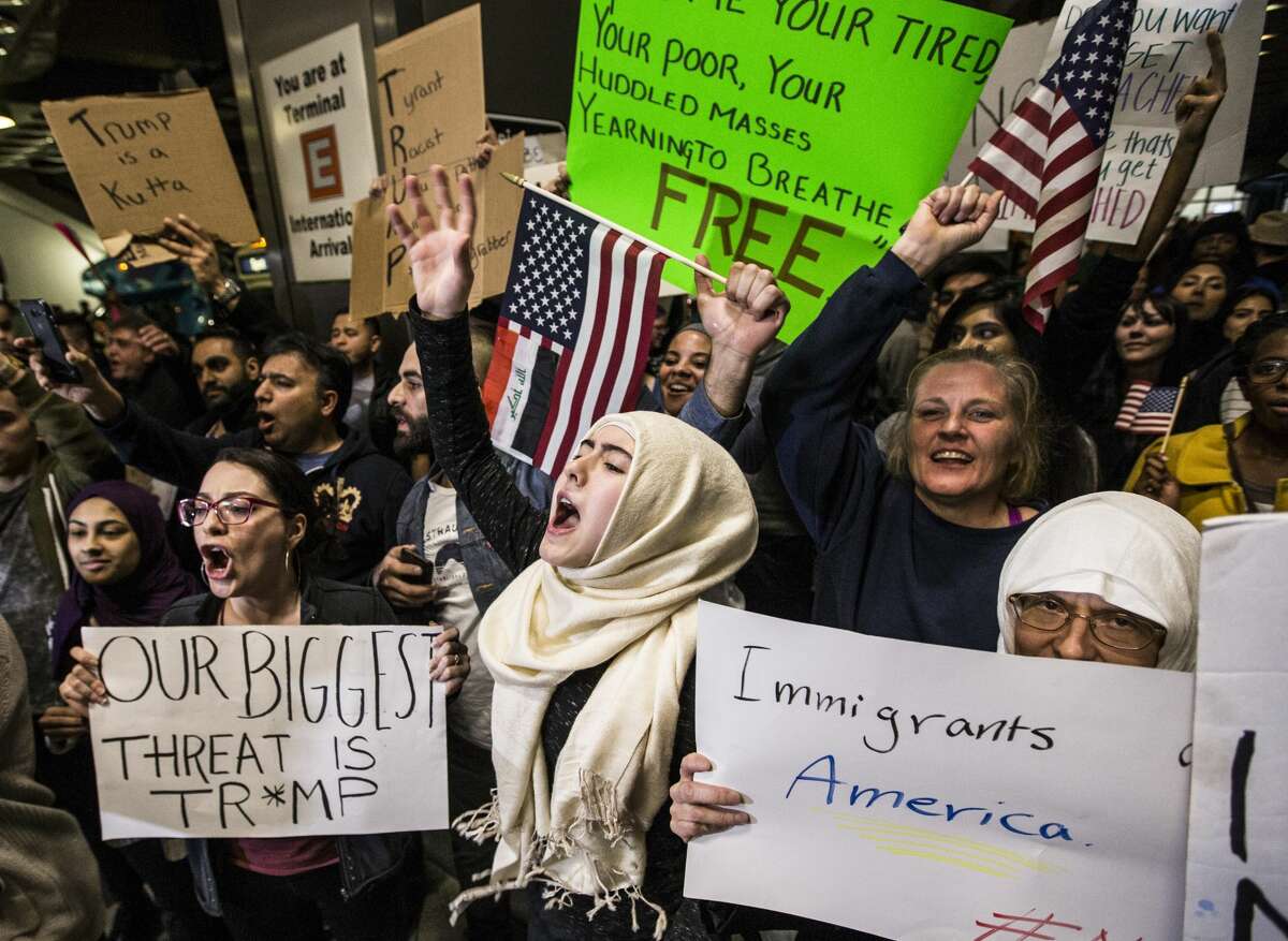 Demonstrators protest against President Donald Trump's executive orders on immigration at George Bush Intercontinental Airport on Sunday, Jan. 29, 2017, in Houston. Sunday's events continue a weekend of unrest in Houston and around the country as federal officials closed the border, blocking families from reuniting in the U.S. and refugees resettling around the country.