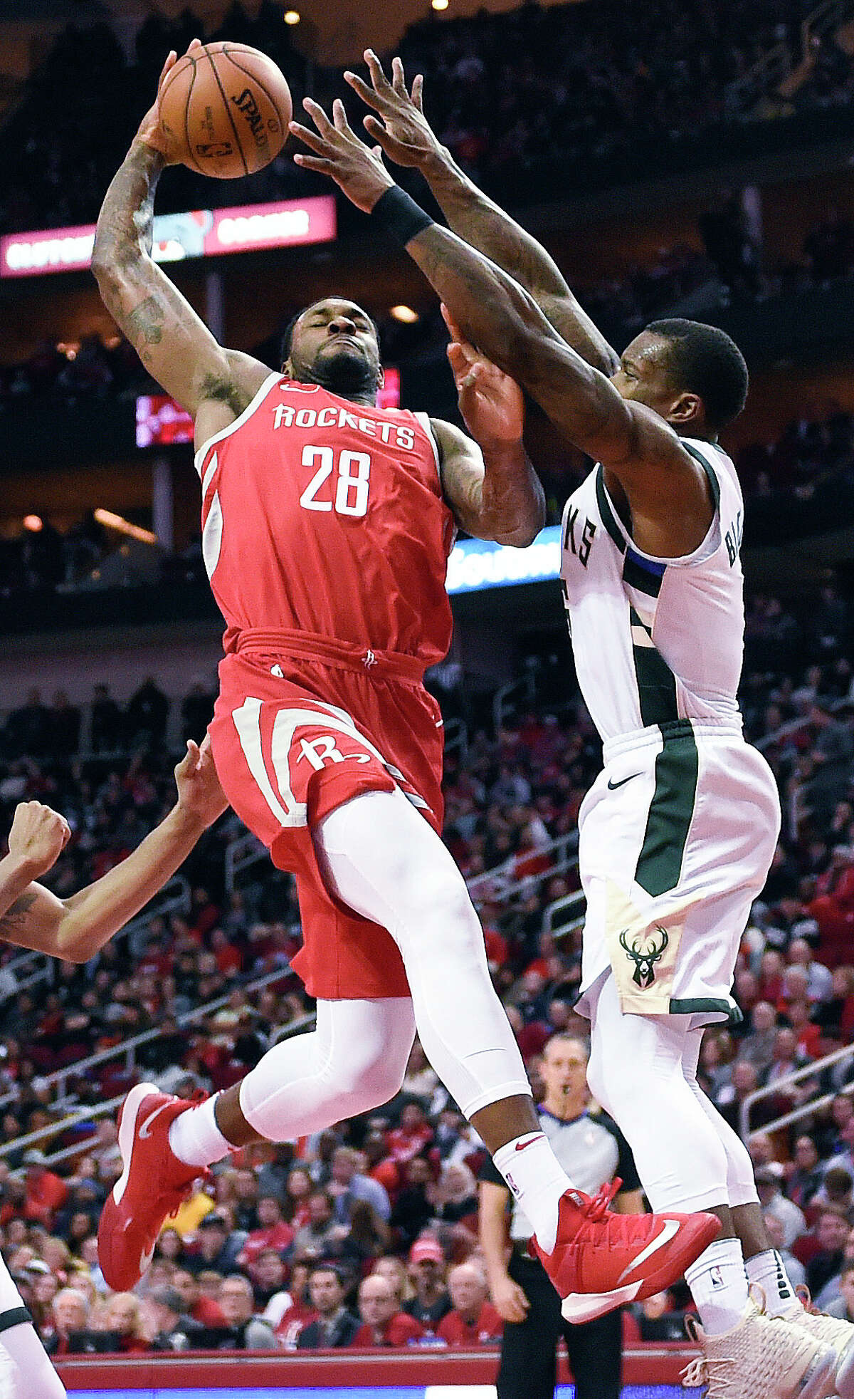 Houston Rockets forward Tarik Black (28) drives to the basket as Milwaukee Bucks guard Eric Bledsoe defends during the second half of an NBA basketball game, Saturday, Dec. 16, 2017, in Houston. Houston won the game 115-111. (AP Photo/Eric Christian Smith)
