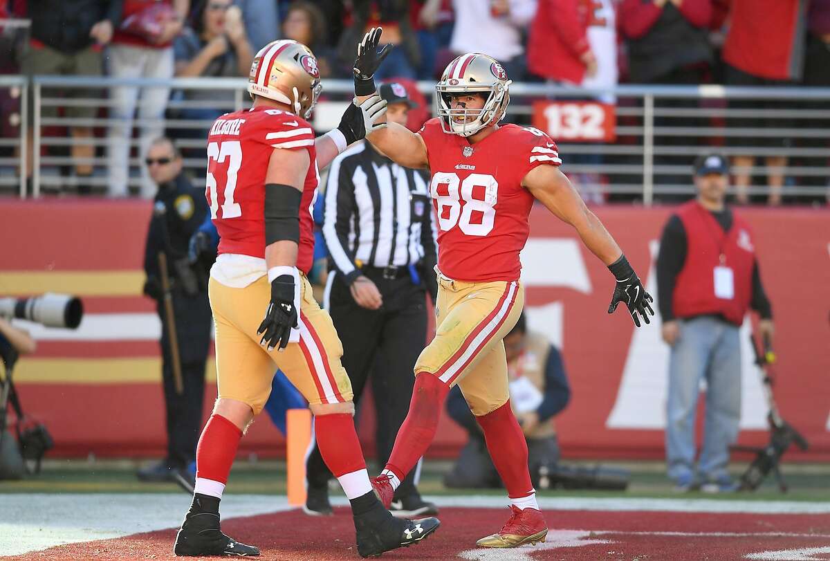 Garrett Celek and Daniel Kilgore of the 49ers celebrates after Celek caught a touchdown pass against the Titans during their game at Levi's Stadium on December 17, 2017.