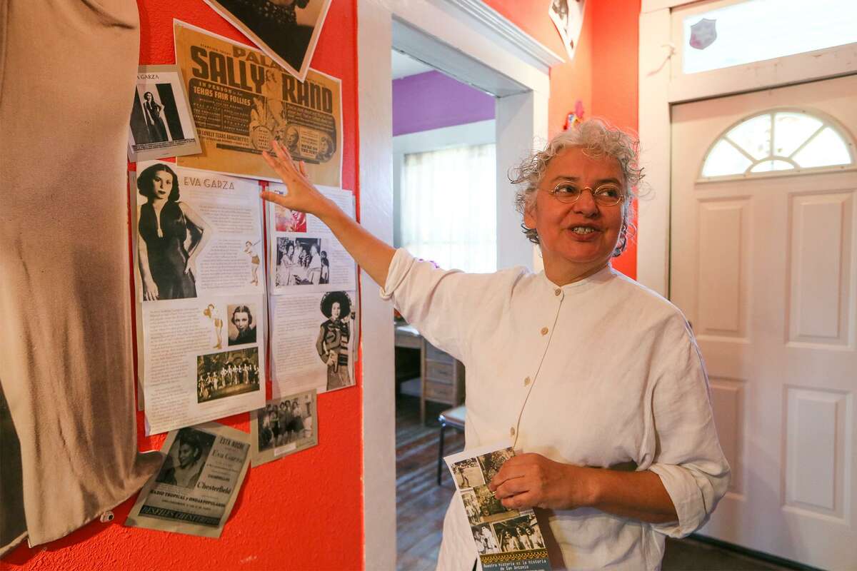 Graciela Sanchez, Director of Esperanza Peace & Justice Center, talks about a tribute to Eva Garza, a Lanier High School alumna, acclaimed singer and actress who grew up in the Alazan-Apace Courts, in the Casa De Cuentos (house of stories) building at MujerArtes Studio, 816 S. Colorao St., on Friday, Dec. 1, 2017. Garza and several other women from the neighborhood are featured in the hallway of the building. MARVIN PFEIFFER/mpfeiffer@express-news.net