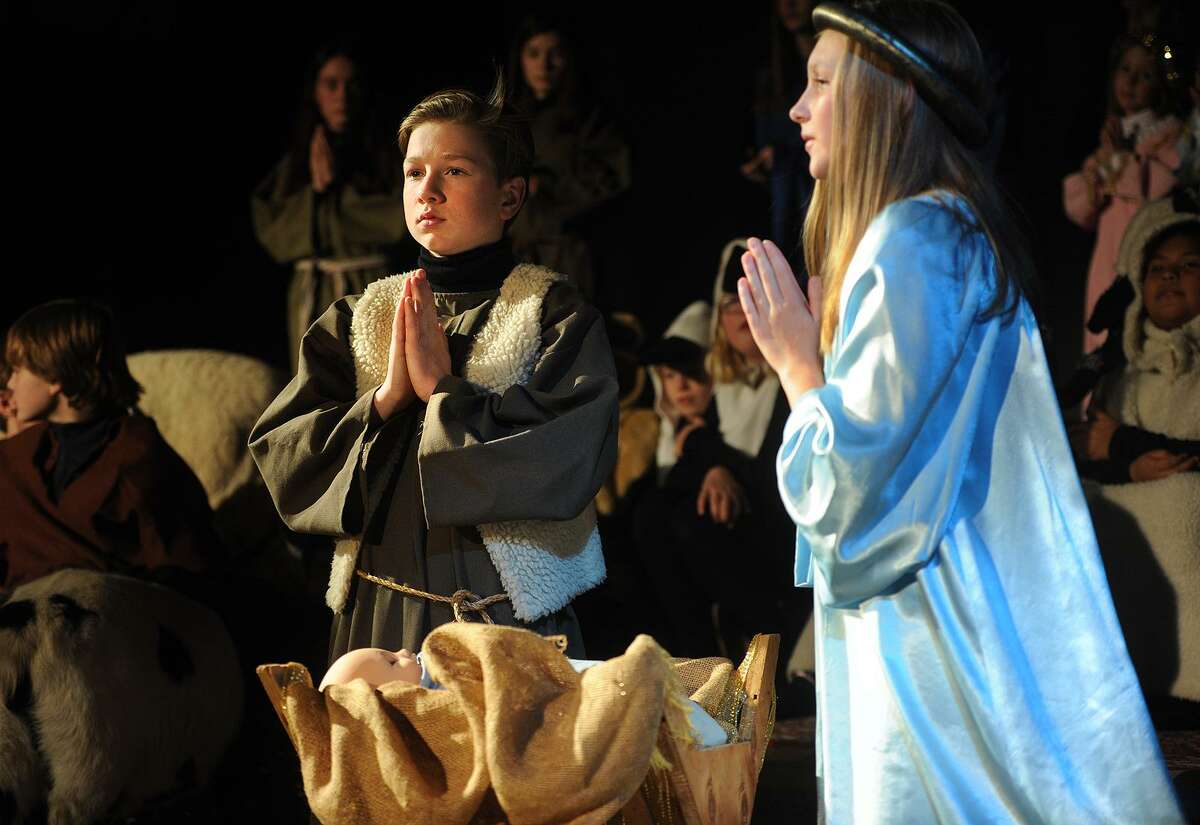 James Auszura performs as Joseph and Ceci Andersen as Mary in the 93rd Annual Christmas Pageant at Trinity Episcopal Church in the Southport section of Fairfield, Conn. on Sunday, December 17, 2017.
