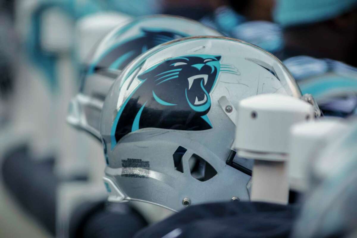 A Carolina Panthers helmet sits on the bench prior to an NFL