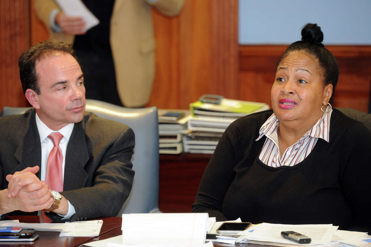 Carolyn Vermont, seen here with Mayor Joe Ganim, speaks at the monthly Communities Working for a Better and United Bridgeport meeting at the Morton Government Center in Bridgeport, Conn. Dec. 18, 2017.