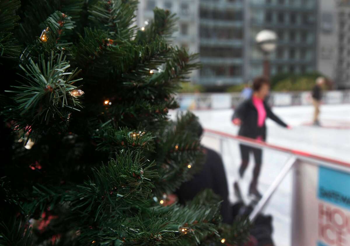 Lights twinkle in a Christmas tree next to the holiday ice skating rink at Union Square in San Francisco, Calif. on Friday, Nov. 3, 2017.