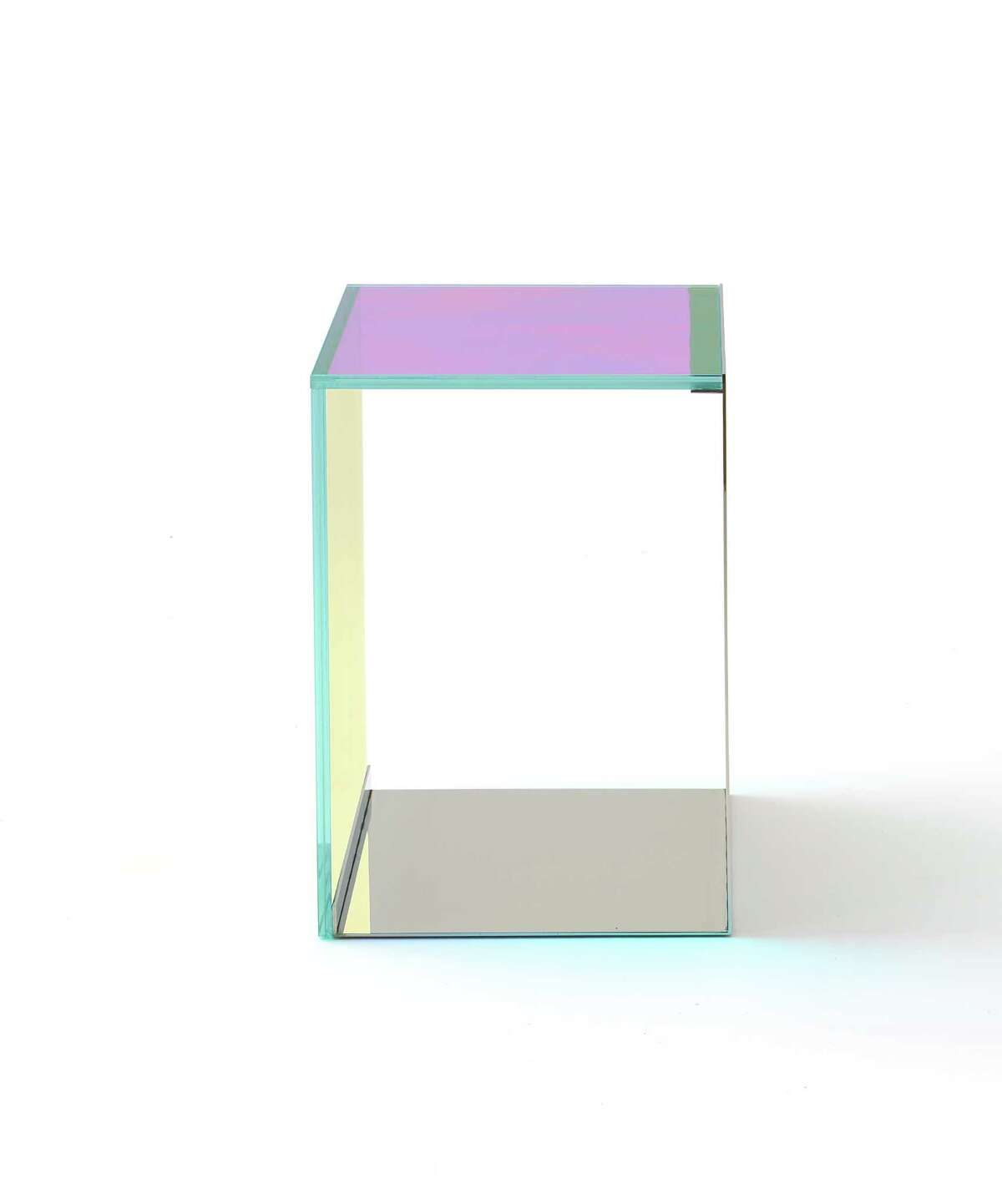 The Dichroic Table, part of the Rottet Collection, is made of dichroic glass and polished metal.