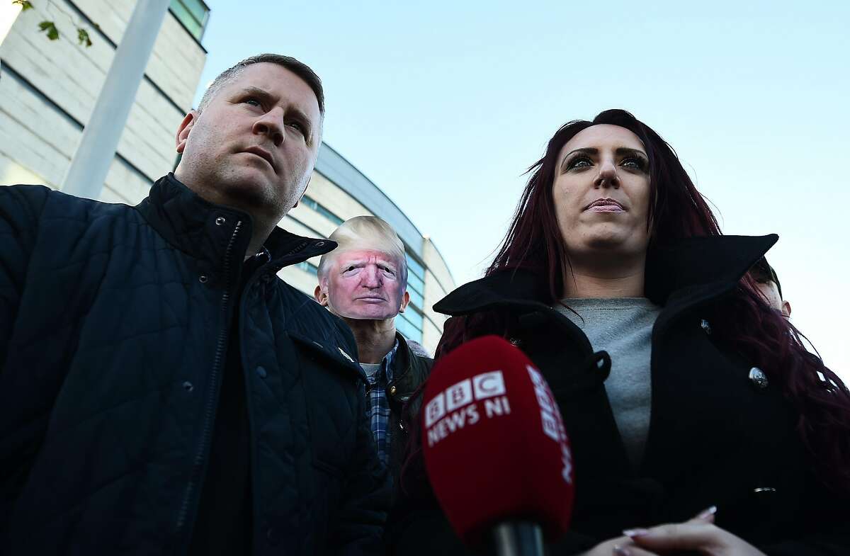 BELFAST, NORTHERN IRELAND - DECEMBER 15: Britain First leader Paul Golding and deputy leader Jayda Fransen talk to the media outside Belfast Laganside Courts after Fransen was released on bail on December 15, 2017 in Belfast, Northern Ireland. Both Britain First leader Paul Golding and his deputy Fransen were arrested yesterday inside the court buildings on separate alleged offences. The Britain First deputy leader Jayda Fransen was initially in court to face a charge of using "threatening, abusive or insulting words or behaviour" relating to a speech she made at a Northern Ireland Against Terrorism rally in Belfast earlier this year. Golding was arrested relating to a speech he made at the same rally. Fransen was re-arrested by PSNI officers in a matter relating to a video she posted about the Belfast Islamic Centre earlier this week. (Photo by Charles McQuillan/Getty Images)