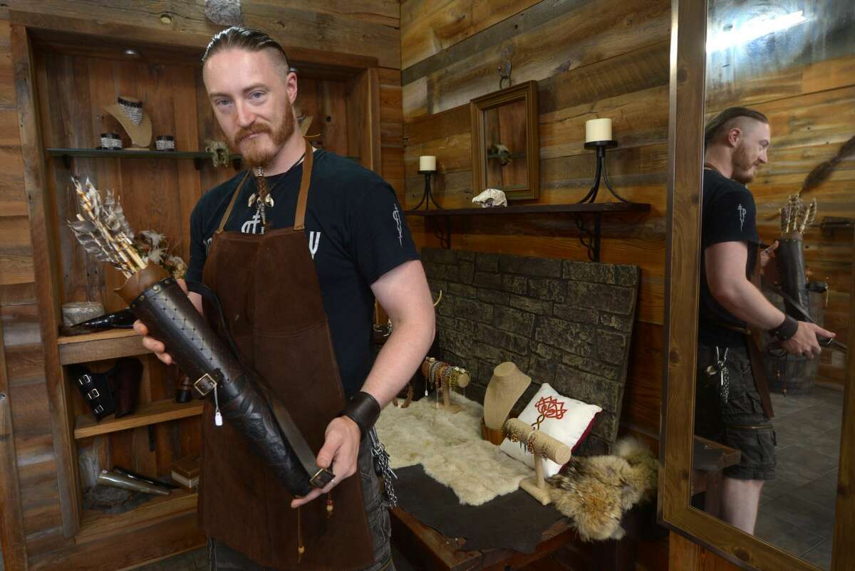 Colin Maythenyi, leather artisan and owner of Knotted Bone, a new business specializing in chain mail jewelry and medieval leather goods, at his shop Friday, August 18, 2017, on Washington Street in Norwalk, Conn.