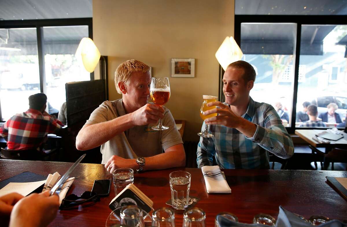 David Yates, (left) and Matt Justus during lunch at Monk's Kettle restaurant and bar in the Mission neighborhood on Monday December 18, 2017, in San Francisco, Ca.
