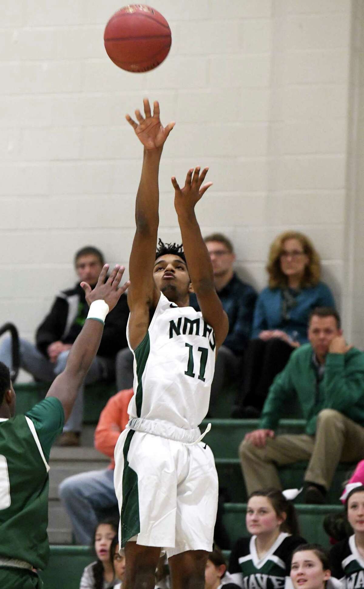 New Milford’s Matthew Brevard makes a shot during the New Milford vs Norwalk boys basketball game at New Milford, Dec. 18, 2017.