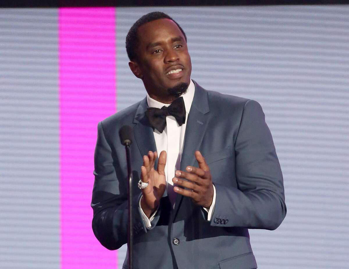 In this Nov. 22, 2015 file photo, Sean Combs presents an award at the American Music Awards in Los Angeles. The veteran music mogul expects to perform on "Pitbull's New Year's Resolution" concert on Fox and will rerelease his recent critically-acclaimed mixtape "Money Making Mitch" through iTunes on Friday. It's the prequel to Puff Daddy's final album "No Way Out 2," which will release next year. (Photo by Matt Sayles/Invision/AP, FIle)