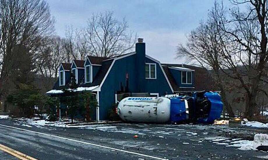Fullyloaded propane truck overturns; Monroe driver cited New Milford