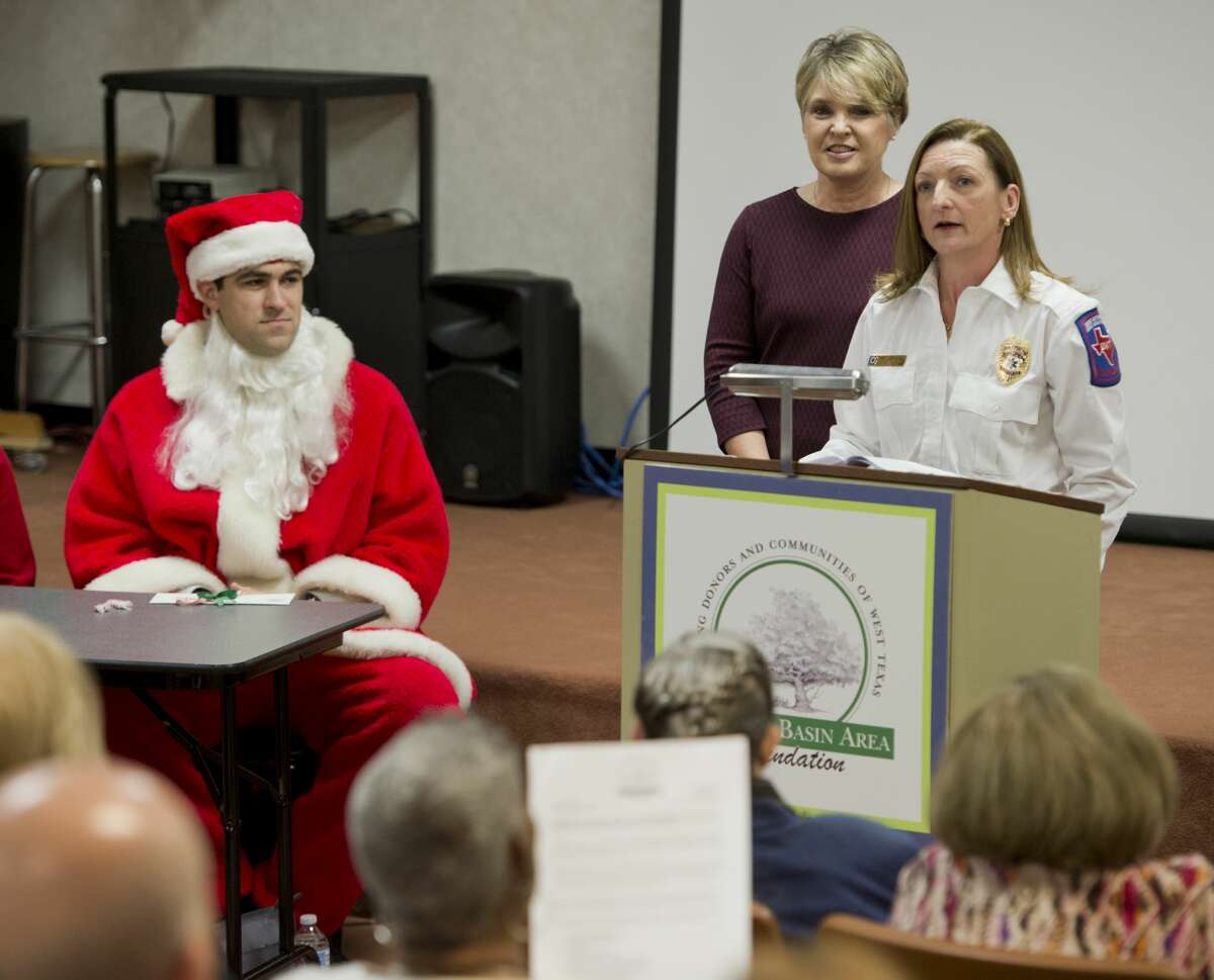 Vickie Fowler, EMS director with Jeff Davis County Ambulance, and Jeannette Duer, County Judge, thank the PBAF for a grant 12/19/17 during the Permian Basin Area Foundation year-end grant allocation. Tim Fischer/Reporter-Telegram