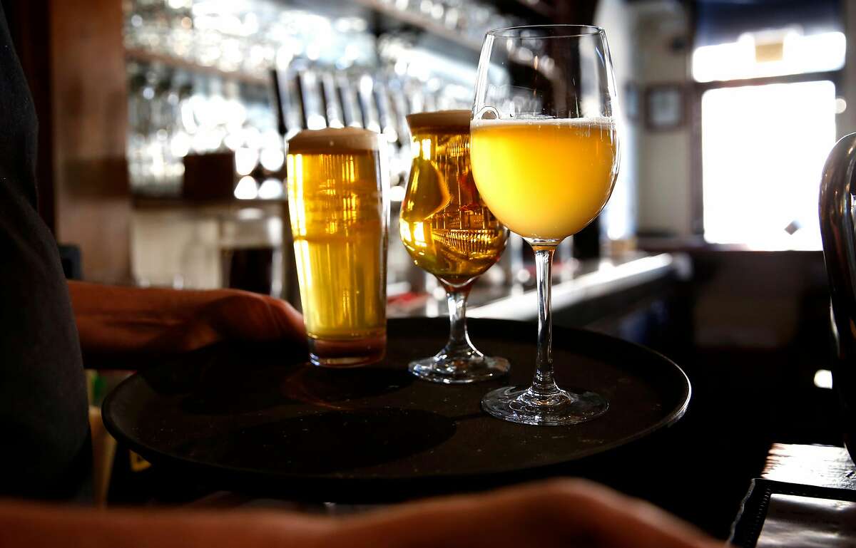 Glasses of beer are served at Monk's Kettle restaurant and bar in the Mission neighborhood on Monday December 18, 2017, in San Francisco, Ca.