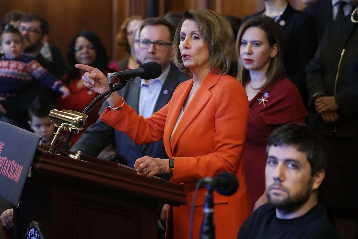 House Minority Leader Nancy Pelosi (D-CA) is joined by fellow House Democrats and people with complex medical needs and disabilities during a rally against the GOP tax bill in the Rayburn Room at the U.S. Capitol December 19, 2017 in Washington, DC. Pelosi invited people who rely on Medicare to rally before the House was to vote on the Tax Cuts and Jobs Act.