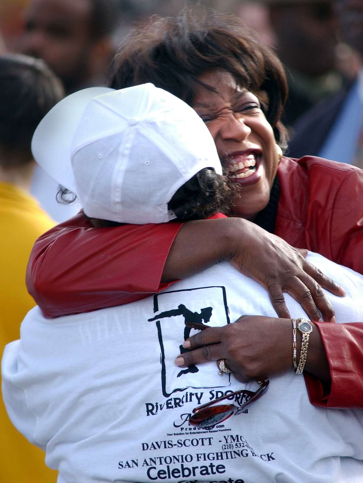 East San Antonio area state Rep. Ruth Jones McClendon hugs parade marshal Paulette Burns before the 2017 MLK march.