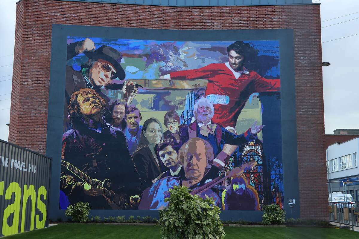 The East Belfast heroes mural on the side of the local visitors center.