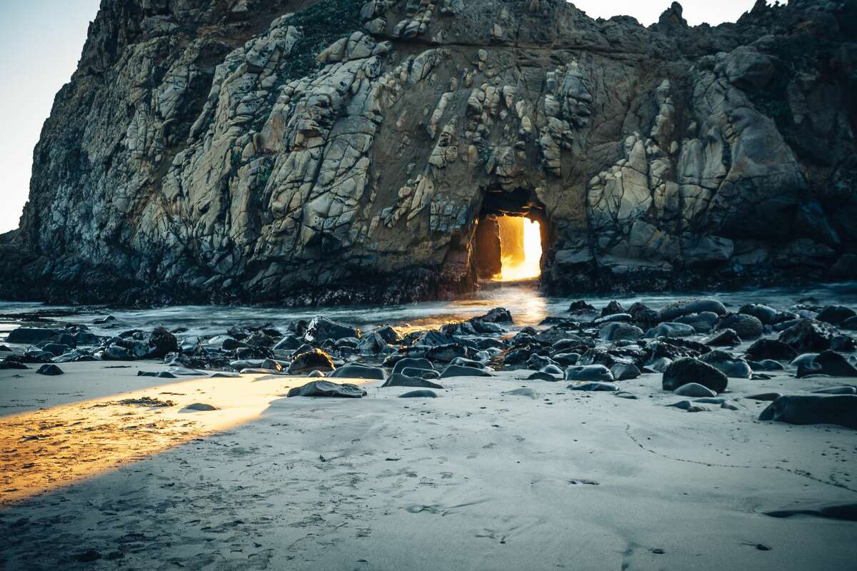 For just a few weeks mid-winter, Keyhole Arch at Pfeiffer Beach in Big Sur, Calif. lights up with an ethereal orange glow. Courtesy: Yusun Chung/@edwoodya