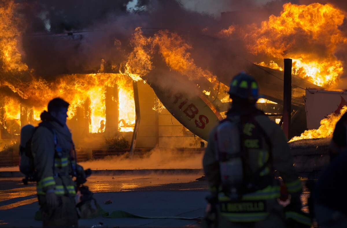 Local firefighters battle a fire that consumed Charlie's Bar-B-Q on Airline Drive Thursday, May 4, 2017, in Houston.