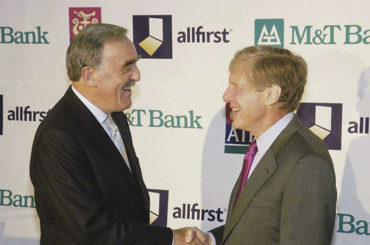 Michael Buckley, group chief executive, Allied Irish Banks p.l.c. (left) and Robert Wilmers, chairman, president and CEO, M&T Bank Corporation (right) announce they have entered into a strategic partnership designed to create a major U.S. regional bank in a $3.1 billion transaction. The merger of M&T and Allfirst, AIB's U.S. subsidiary, will create a strong mid-Atlantic banking franchise with over 700 branches in six states and the District of Columbia. (PRNewsFoto)