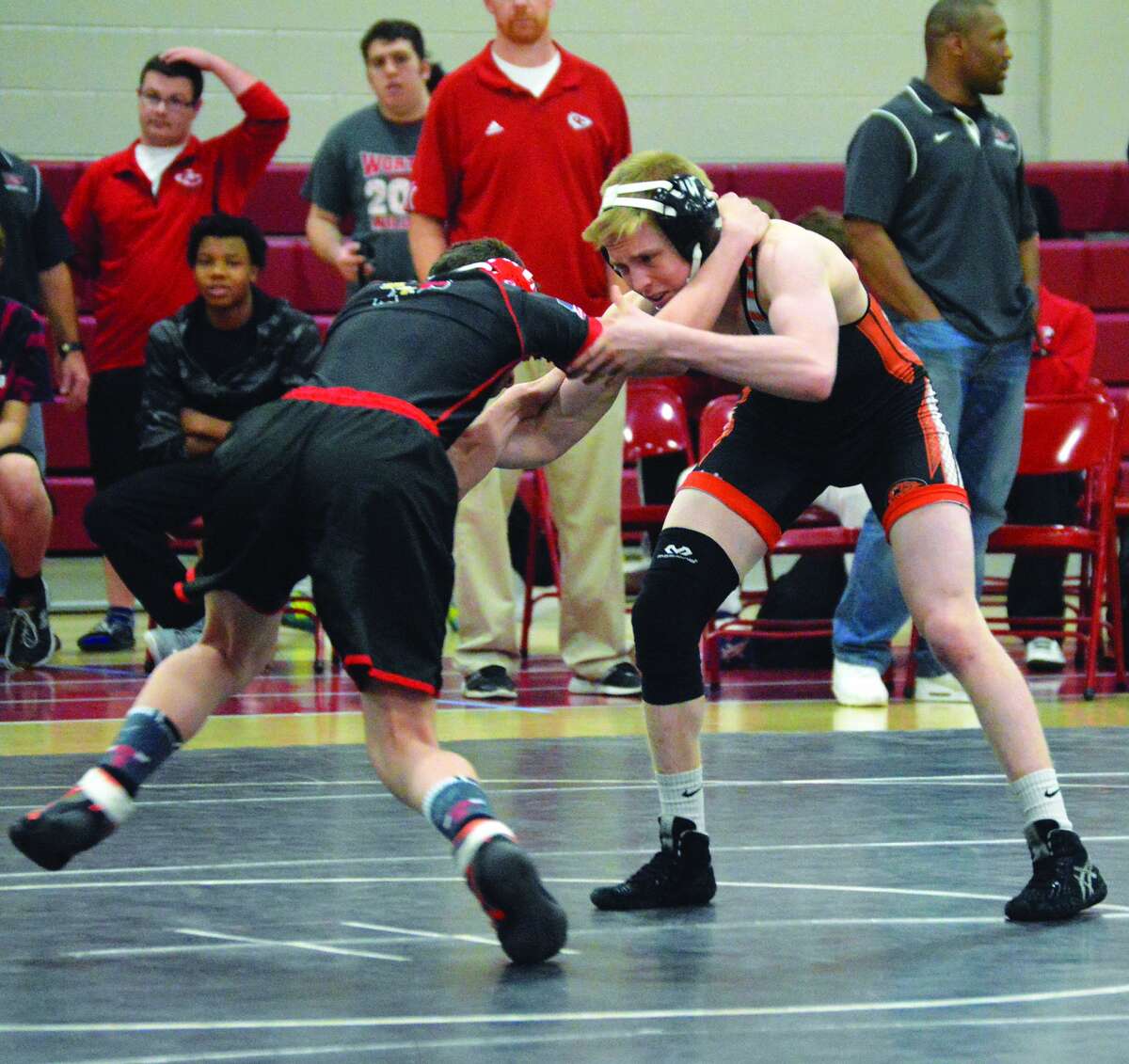 Edwardsville’s Noah Surtin, right, wrestles against Granite City during a 120-pound bout in Southwestern Conference action.
