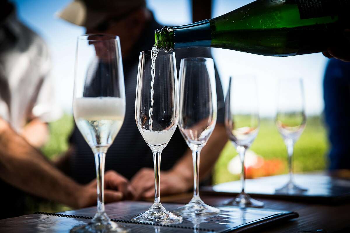 Sparkling wine is poured for tasting at Iron Horse Vineyards in Sebastopol.