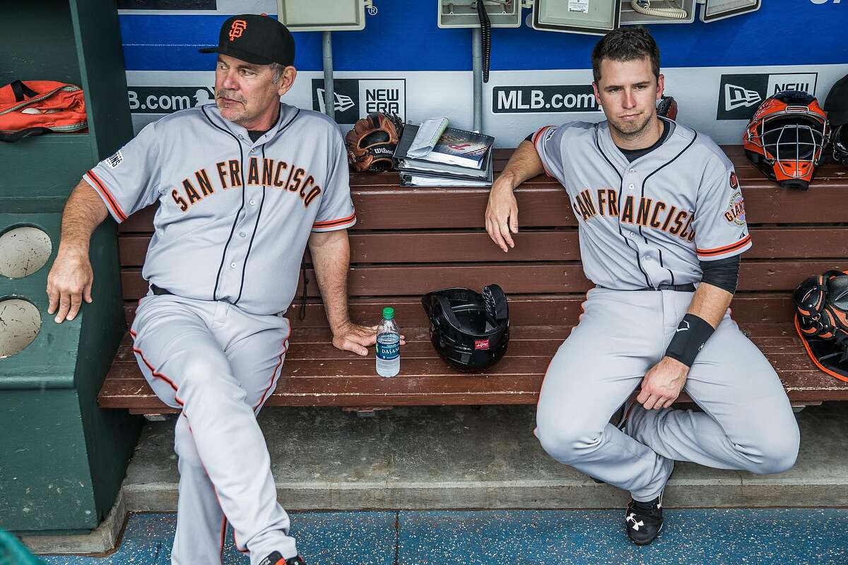 Manager Bruce Bochy #15 and Buster Posey #28 of the San Francisco Giants look on before the game against the Philadelphia Phillies at Citizens Bank Park on Saturday, June 6, 2015 in Philadelphia, Pennsylvania.