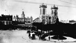 Main Plaza, circa 1892. Left to right: the Southern Hotel, the towers of City Hall above the Hole in the Wall Restaurant, San Fernando Cathedral and Frost National Bank. The oldest part of the Cathedral was built 1738-49, but the Gothic facade was not completed until 1873.