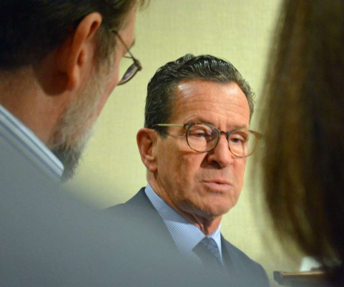 Gov. Dannel P. Malloy, guest speaker at Wednesday’s Middlesex County Chamber of Commerce member breakfast at the Cromwell Radisson, speaks to reporters about the state’s inadequate transportation system, Republican tax plan and other issues.
