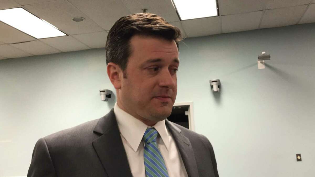 Sean Kimball talks with reporters after he was appointed Wednesday night to become Cheshire's next Town Manager. The 36-year-old Kimball, who lives in Cheshire, will start his new job in May, about a month before current Town Manager Michael Milone retires.