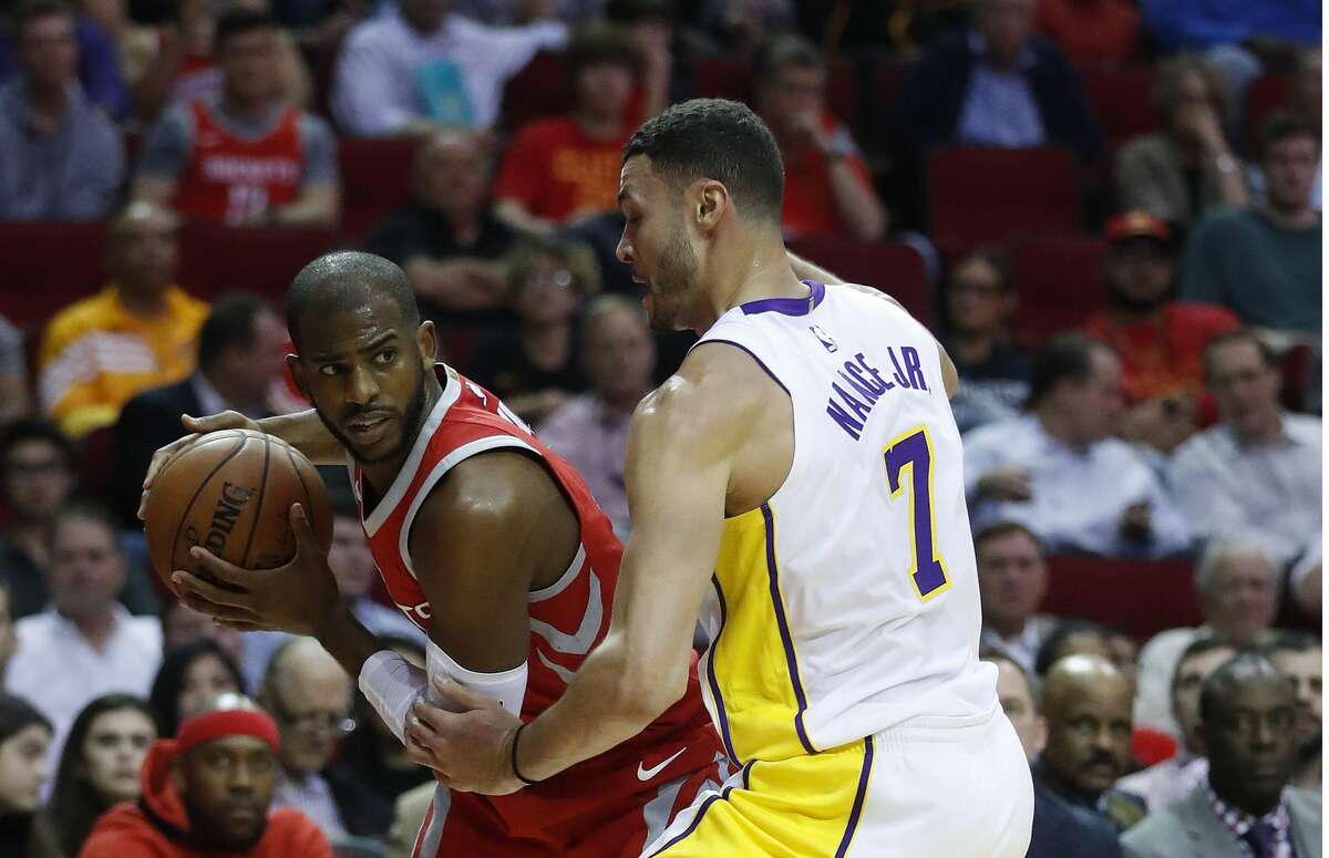 Houston Rockets guard Chris Paul (3) tries to get past Los Angeles Lakers forward Larry Nance Jr. (7) during the first half of an NBA basketball game at Toyota Center, Wednesday, Dec. 20, 2017, in Houston. ( Karen Warren / Houston Chronicle )
