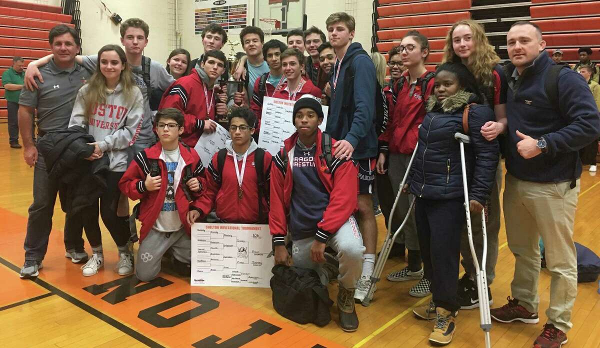 The Greens Farms Academy wrestling team poses for a photo after winning the Shelton Invitational wrestling meet on Saturday in Shelton. The team includes wrestlers from throughout many Fairfield County towns.