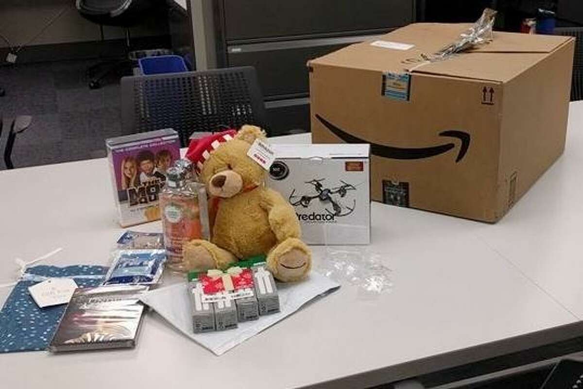 A stuffed toy bear in a Santa hat was among the items stolen from porches in Hayward and recovered Wednesday by police, who arrested two men suspected of swiping a package that officers equipped with a tracking device.