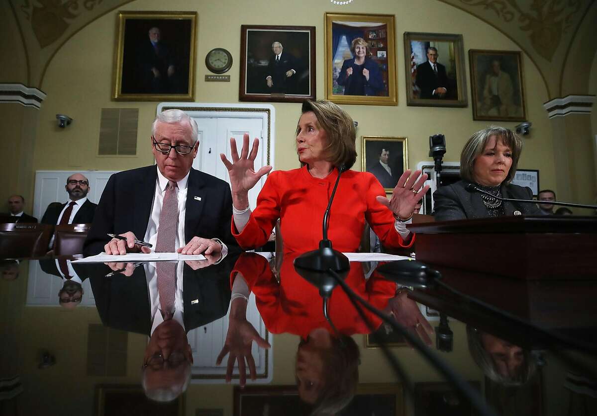 WASHINGTON, DC - DECEMBER 21: House Minority Leader, Nancy Pelosi (D-CA), (C), House Minority Whip, Steny Hoyer (D-MD), and Rep. Michelle Lynn Lujan Grisham (D-NM) (R), participate in a House Rules Committee meeting as negotiations continue on funding the government to avert a shutdown at midnight on Friday night, at the U.S. Capitol on December 21, 2017 in Washington, DC. (Photo by Mark Wilson/Getty Images)