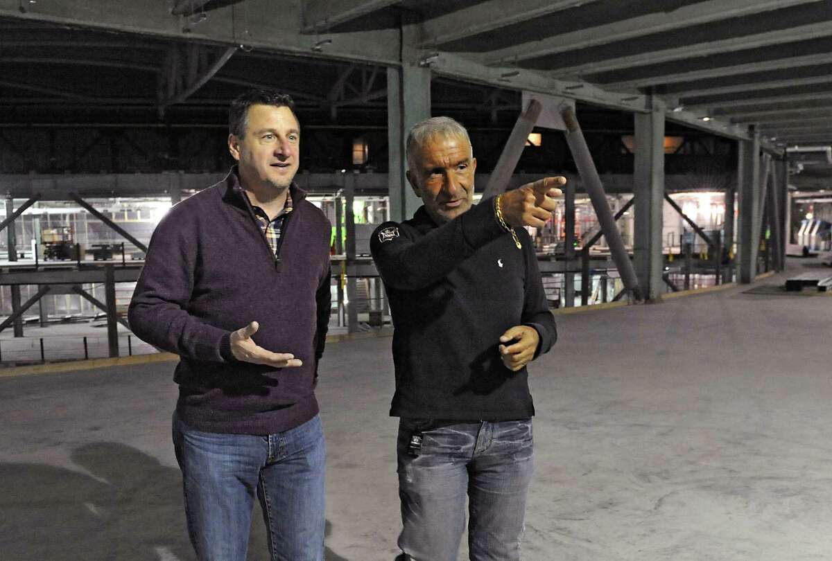 Frank Poore, former CEO of CommerceHub, left, and Alain Kaloyeros, the founder of Albany Nanotech, tour the ZEN building when it was under construction on Thursday, Dec. 11, 2014, in Albany, N.Y. After 5 years in ZEN, CommerceHub moved to Latham. (Lori Van Buren / Times Union archive)