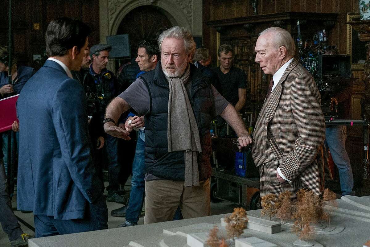 Mark Wahlberg (left) and Christopher Plummer (right) receive direction from Ridley Scott (center) on the set of "All the Money in the World." Photo: Giles Keyte